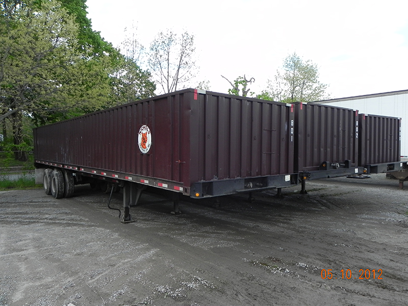 Container trailers and equipment staged in the Nichols Trucking yard in Middleboro, Massachusetts